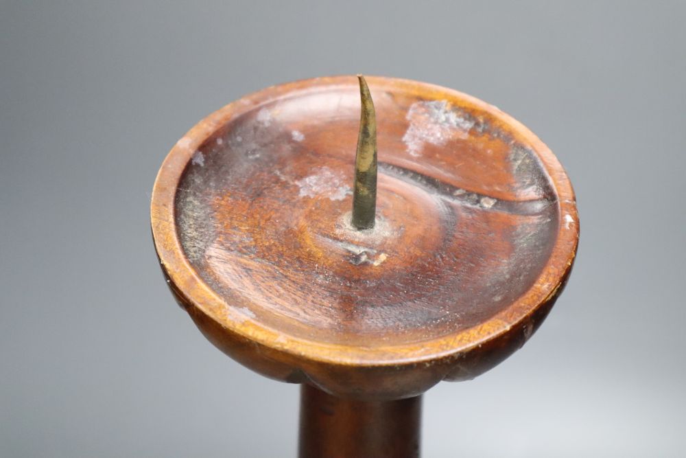 A carved hardwood pricket candlestick, height 58cm